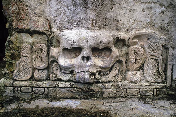 Skull carving at Palenque ruins, Mexico