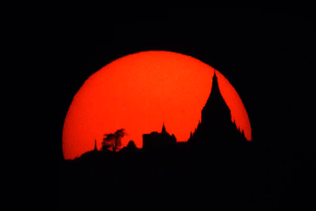 Setting sun behind the Tant Kyi Taung Pagoda, near Bagan Setting sun behind the Tant Kyi Taung Pagoda, near Bagan