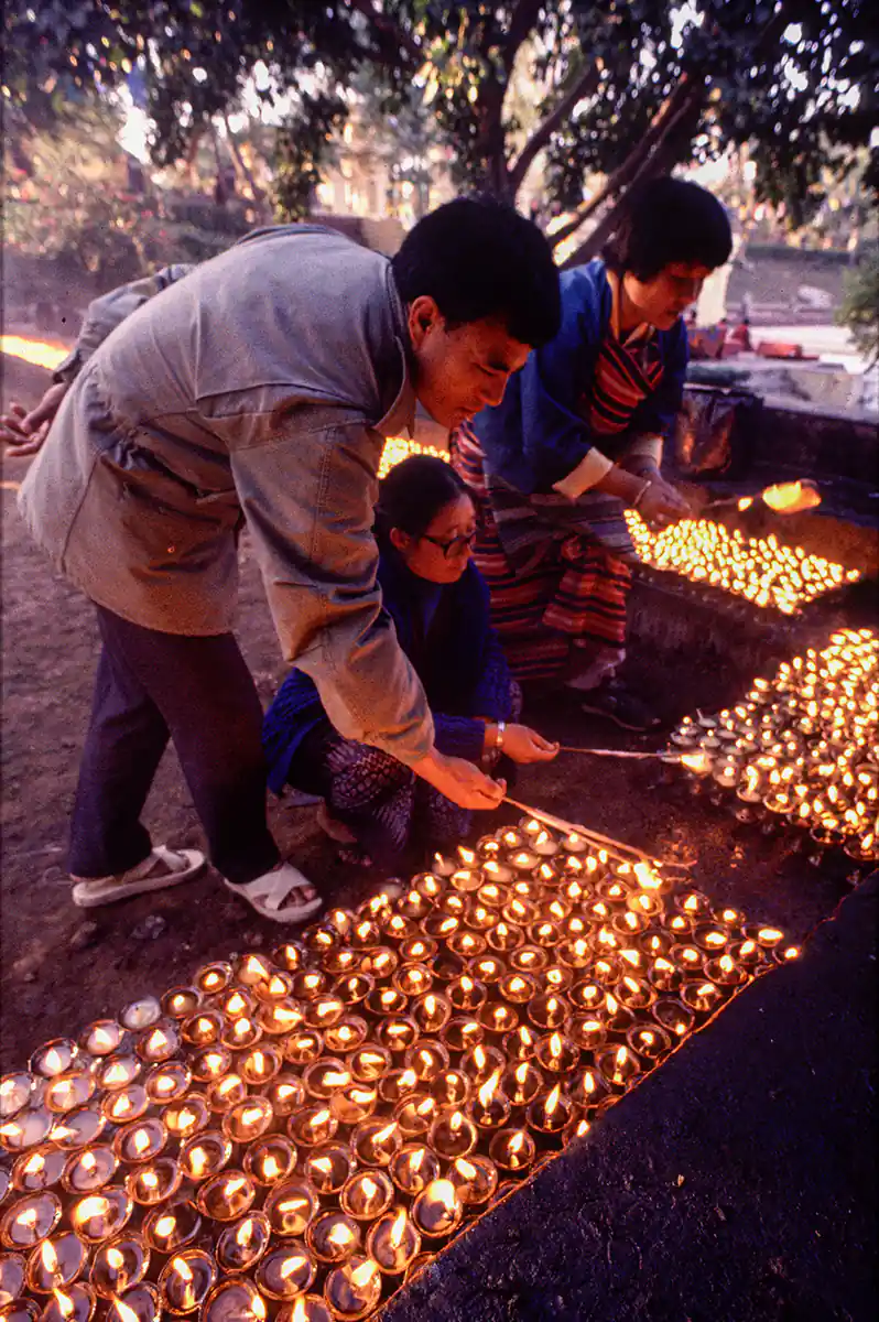 Buddhist Pilgrims lighting candles, Bodh Gaya Buddhist Pilgrims lighting candles, Bodh Gaya