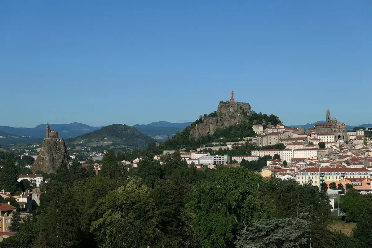 Panorama of the city of Le Puy with two pilgrimage places on horizon. The Chapel of St. Michael on the far left and the Cathedral of Notre Dame on the far right Panorama of the city of Le Puy with two pilgrimage places on horizon. The Chapel of St. Michael on the far left and the Cathedral of Notre Dame on the far right