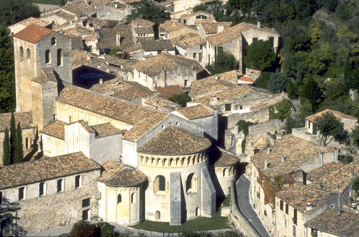 Hilltop view of the church and town of Saint-Guilhem-le-Desert, France