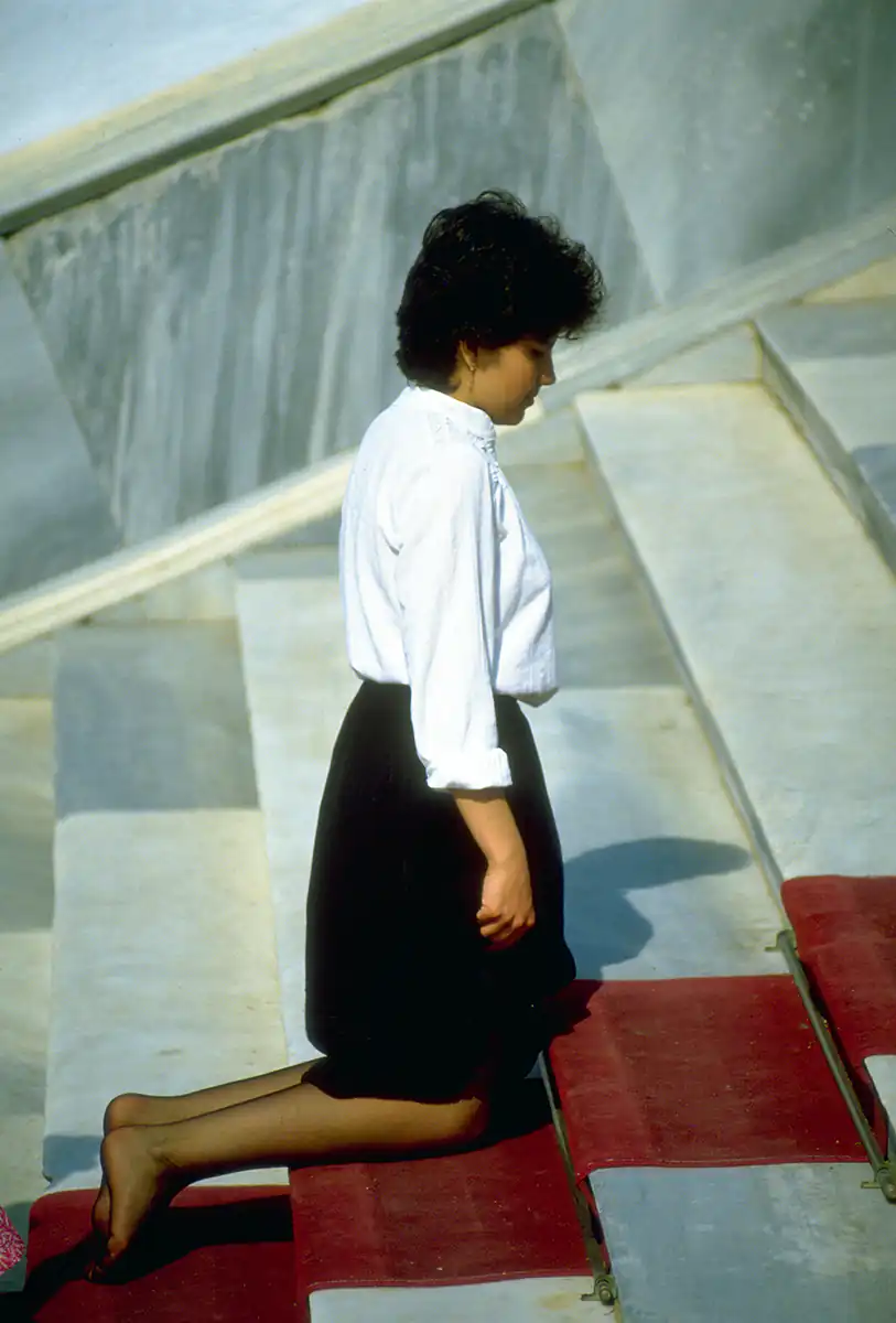 Pilgrim at the Church of the Megalohari, Tinos Island, Greece Pilgrim at the Church of the Megalohari, Tinos Island, Greece
