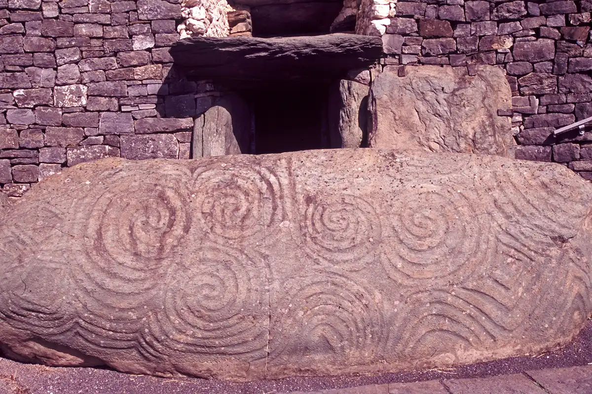Carved stone at entrance to Newgrange Megalithic Cairn Carved stone at entrance to Newgrange Megalithic Cairn