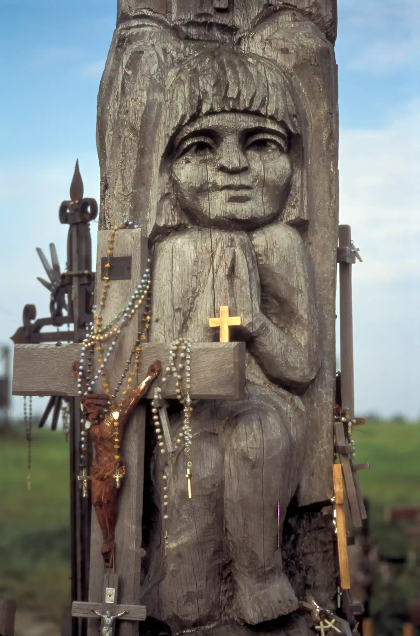 Crosses and carvings left by pilgrims, Hill of Crosses Crosses and carvings left by pilgrims, Hill of Crosses