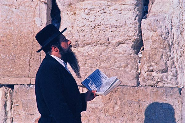 Hasidic Jew praying at the Western Wall in Jerusalem