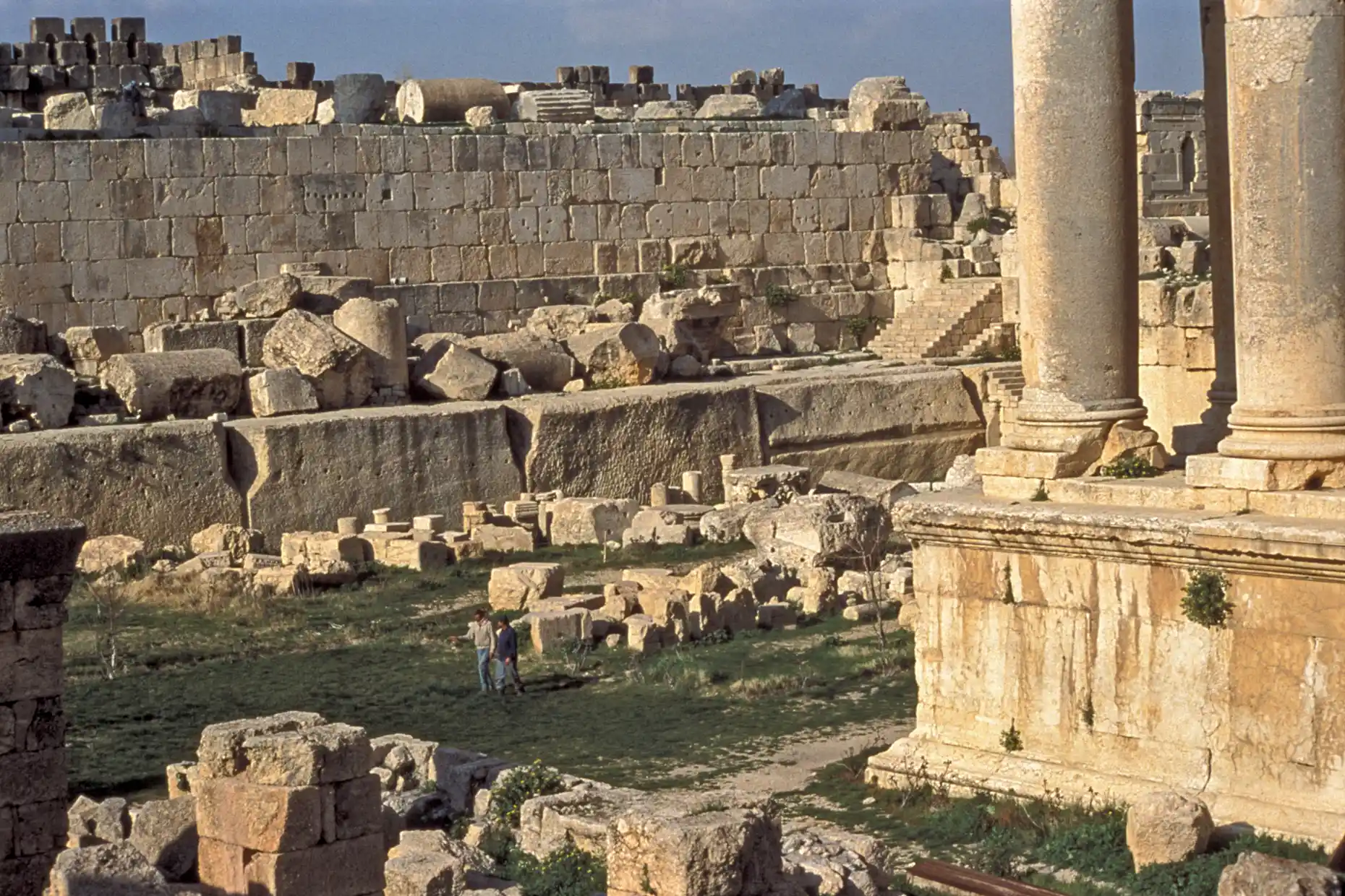 At the base of the far wall, the great stones of Baalbek At the base of the far wall, the great stones of Baalbek