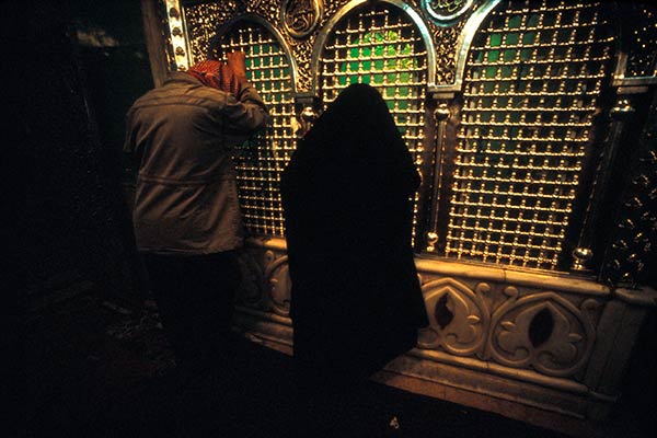 Pilgrims in prayer at the shrine of Zecharia