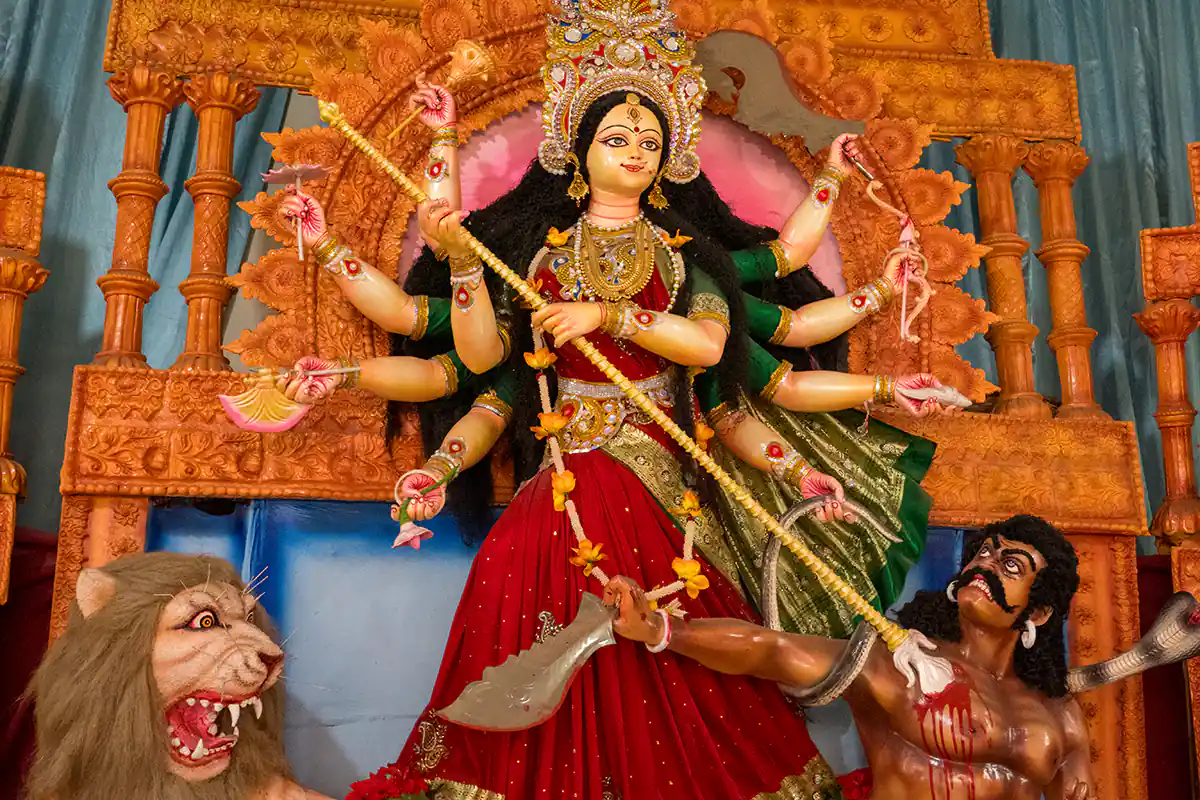 Statue of the goddess Durga killing a demonic mythological being, Dhakeshwari Temple, Dhaka, Bangladesh Statue of the goddess Durga killing a demonic mythological being, Dhakeshwari Temple, Dhaka, Bangladesh