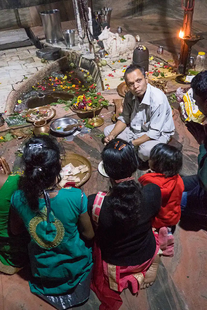 Temple priest and pilgrims at Sivadol Temple Temple priest and pilgrims at Sivadol Temple