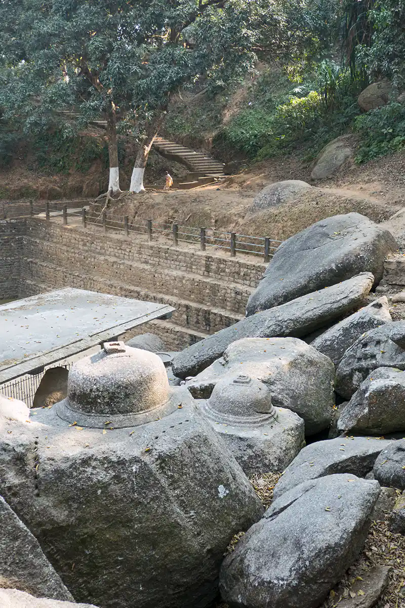 Boulders carved with Buddhist votive stupas Boulders carved with Buddhist votive stupas