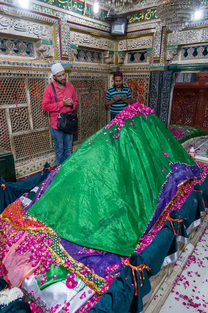 Pilgrim praying inside shrine of Nizamuddin Dargah, New Delhi