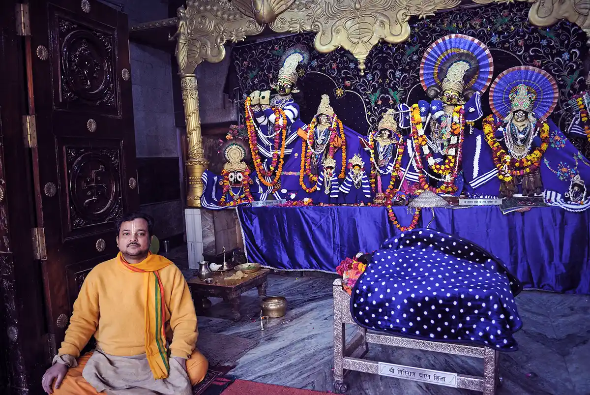 Hindu priest with statues of Krishna and Gopis, Vrindavan Hindu priest with statues of Krishna and Gopis, Vrindavan