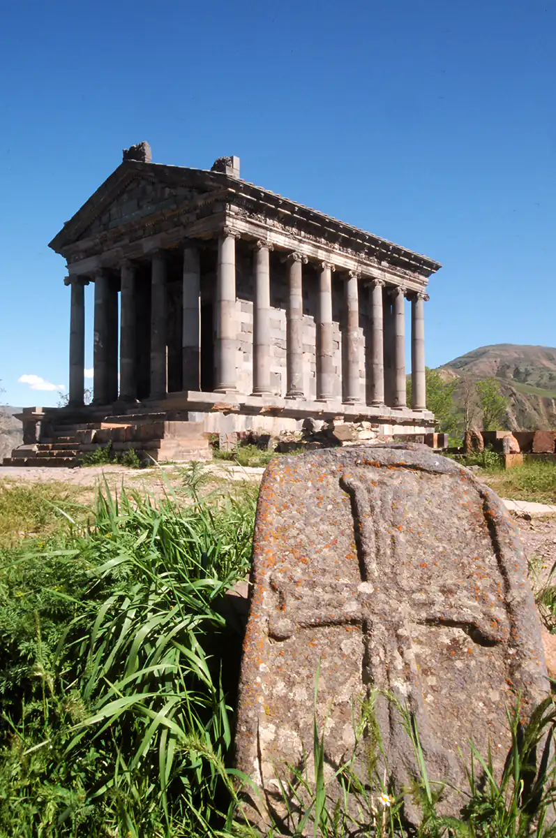 Pagan temple of Garni and old stone cross Pagan temple of Garni and old stone cross